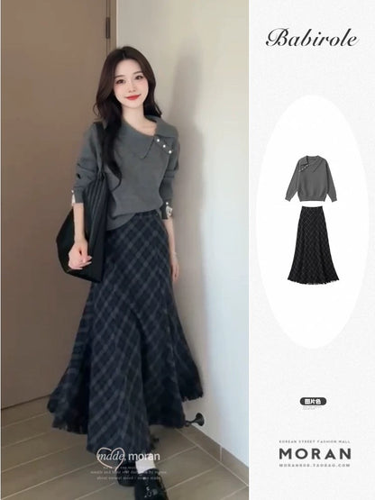 Korean-style autumn/winter outfit: a retro-chic gray sweater and plaid skirt two-piece set.