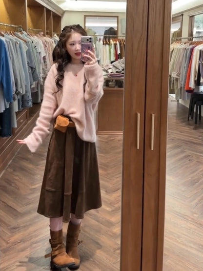 Soft, creamy pink pullover sweater and a relaxed, chic skirt set for petite women, perfect for autumn and winter.