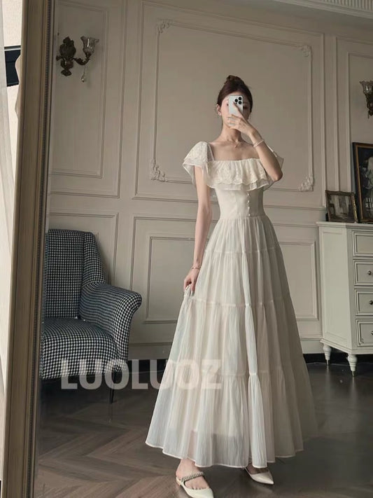 LUOLUOZ "White Lotus Elegance" – Off-shoulder, ruffled, slimming, and soft-style long dress (JF1473)