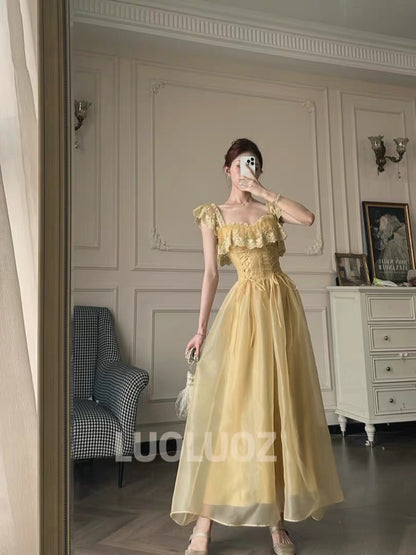 LUOLUOZ "Soft Yellow Dream" – A gentle-style long dress featuring ruffles, a fitted waist, and a wrap-style lace-up design (JF1424).