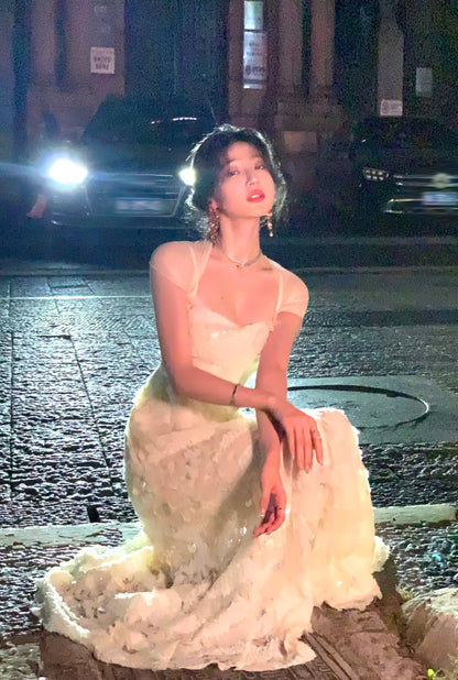Wan's elegant and ethereal white fishtail dress with sequins, perfect for an evening gown. A new high-end style for autumn 2024.