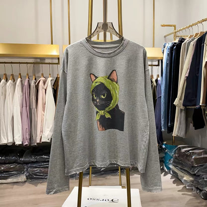 [Real-life shot from Xiao Ai's shop] Autumn 2026 Korean-style loose-fit long-sleeve sweatshirt for women featuring a quirky cat print—a youthful, flattering top.