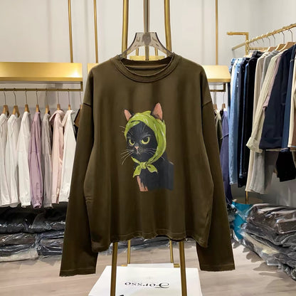 [Real-life shot from Xiao Ai's shop] Autumn 2026 Korean-style loose-fit long-sleeve sweatshirt for women featuring a quirky cat print—a youthful, flattering top.
