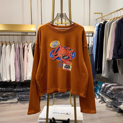 [Real-life photos from Xiao Ai's shop] Women's casual autumn sweatshirt featuring a cartoon letter print, crew neck, long sleeves, and a loose fit.