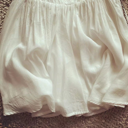 European and American style French retro white small fresh solid color waist suspender skirt for women on vacation