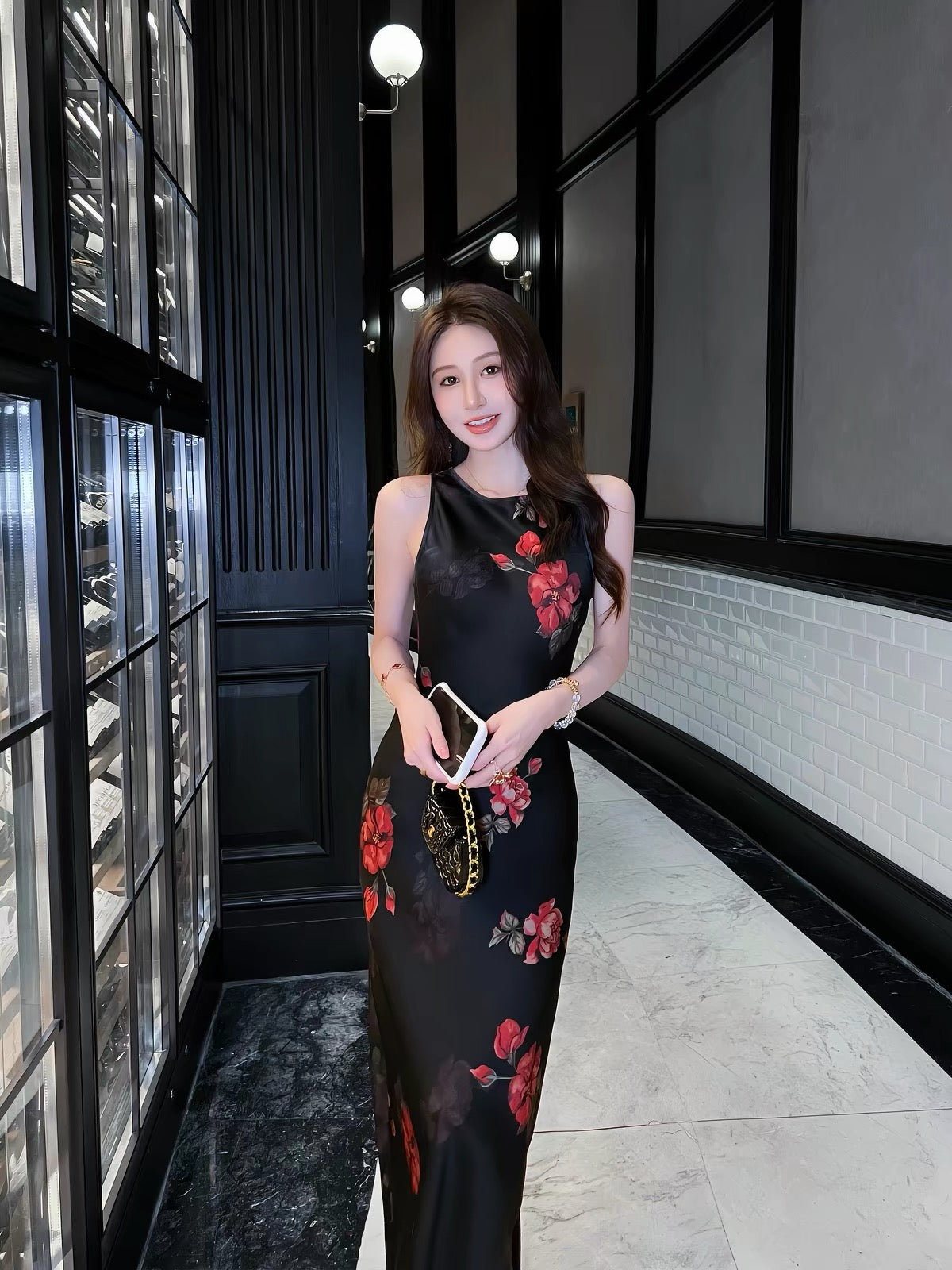 Stunning French-style black floral acetate camisole dress with a V-neck—a new summer arrival featuring a figure-flattering, slim-fit, and elegant long silhouette.