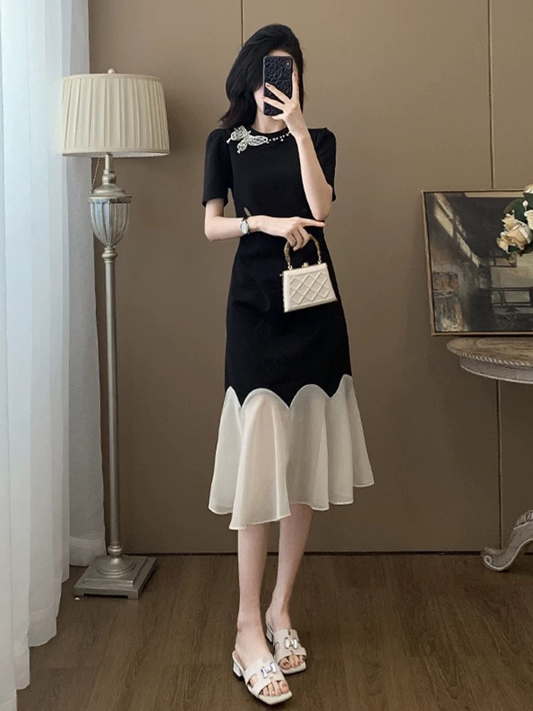 Black short-sleeved dress for women summer 2025 new style this year popular style temperament splicing niche no collision style skirt