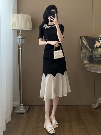 Black short-sleeved dress for women summer 2025 new style this year popular style temperament splicing niche no collision style skirt