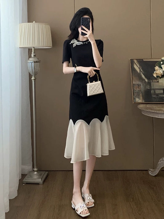 Black short-sleeved dress for women summer 2025 new style this year popular style temperament splicing niche no collision style skirt