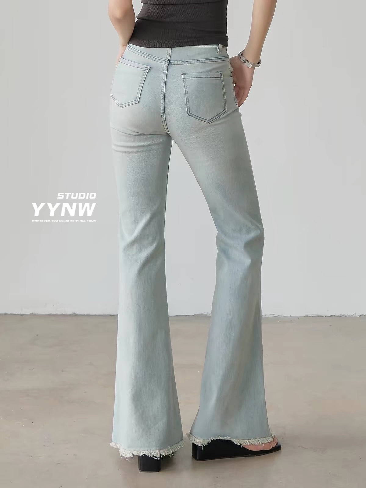Women's American-style light blue raw-hem slight-flare jeans (2026 new summer collection): high-waisted, slim-fit, and flattering full-length bootcut style.