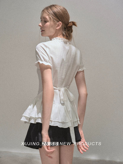 "Narrative Realm" French-style white design short-sleeved shirt with ruffled trim, summer fitted waist and puff detailing.