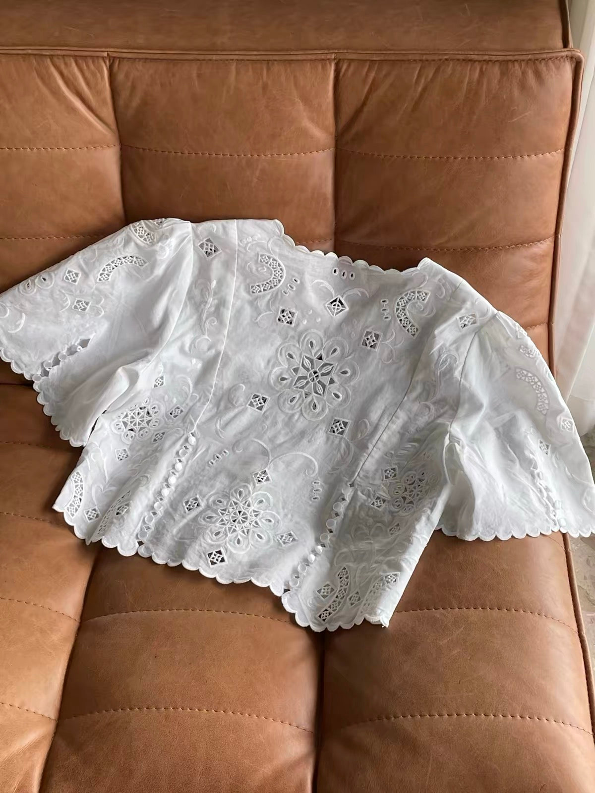 Women's Early Autumn Loose Short-Sleeve Shirt with Laser-Cut Embroidery, Button Detail, and Side Slits – Scalloped-Edge Top