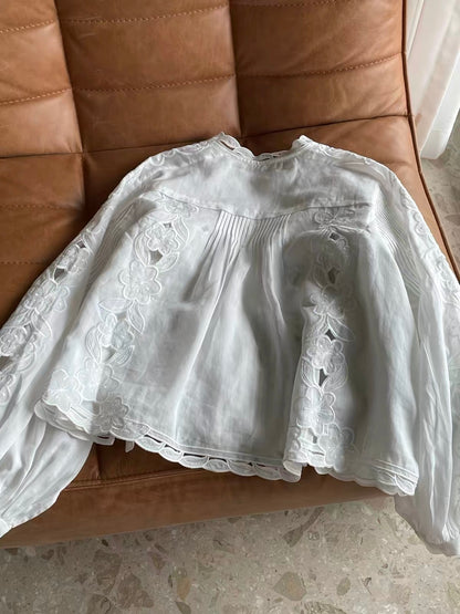 Women's French-style romantic long-sleeve ramie shirt featuring delicate cut-out floral embroidery, vertical pleats, and a lightweight, breathable design—perfect for early autumn.