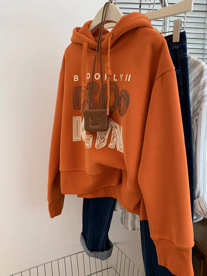 Orange plus velvet thickened hooded sweatshirt for women autumn and winter European goods small size straight shoulder pullover early autumn 2025 new style