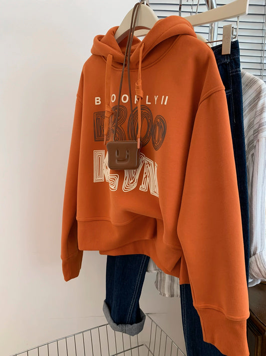Orange plus velvet thickened hooded sweatshirt for women autumn and winter European goods small size straight shoulder pullover early autumn 2025 new style