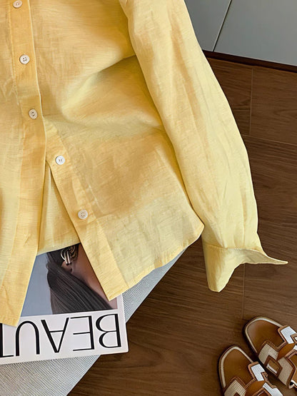 "Old Money" aesthetic: a minimalist yellow long-sleeved collared shirt for women, perfect for spring and autumn—featuring a relaxed, effortless, and loose fit that doubles as a light shirt-jacket.