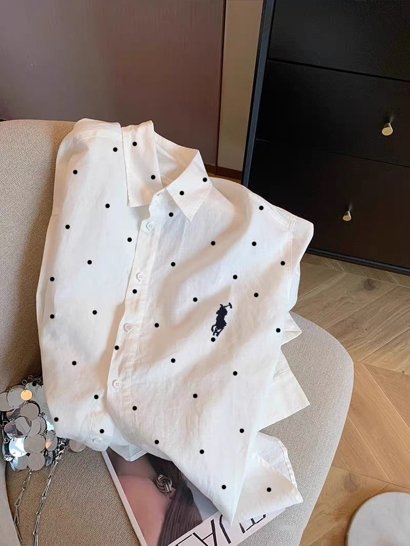 Women's French-style chic white polka-dot long-sleeve shirt with a polo collar; a lightweight, relaxed-fit piece suitable for summer as a shirt or light outer layer.