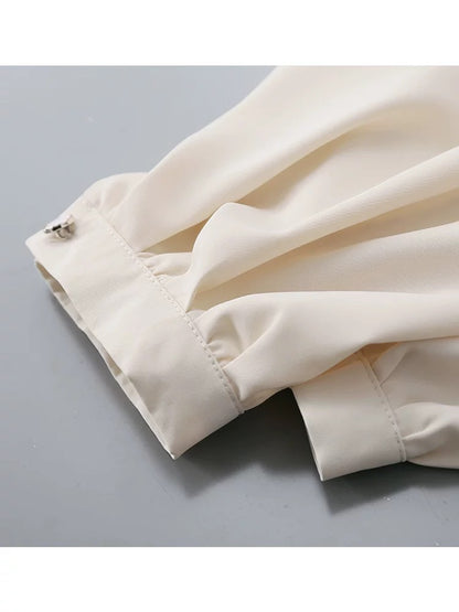 Retro French apricot stand collar lantern sleeve satin shirt female 2025 spring and autumn new drape niche top