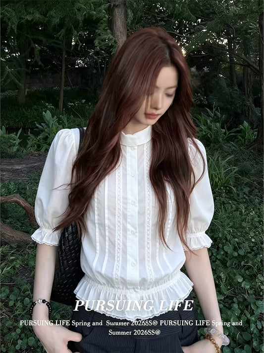 Women's French-style white collared "faux-layered" shirt; a stylish summer top featuring a fitted waist, slimming silhouette, pleated detailing, and three-quarter sleeves.