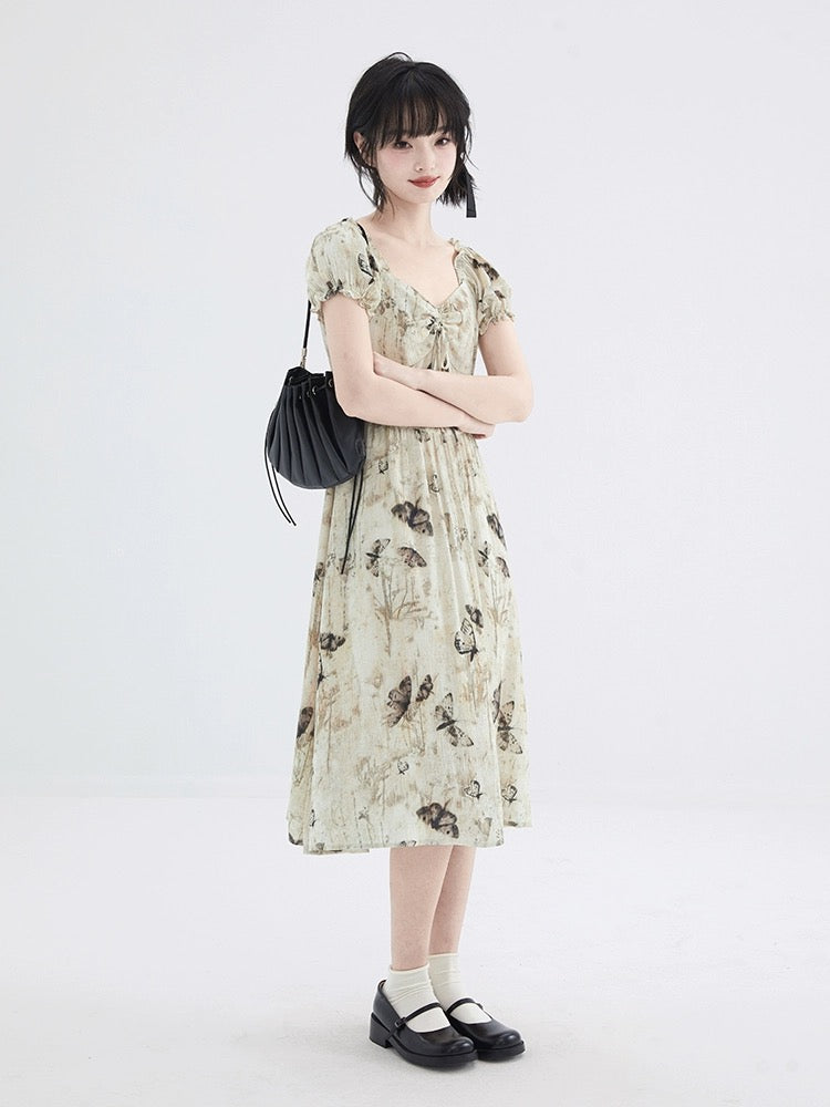 Shallot's well-tailored butterfly print textured dress, mid-length summer waist-cinching puff sleeves, sweet A-line skirt