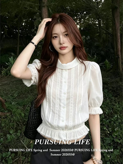 Women's French-style white collared "faux-layered" shirt; a stylish summer top featuring a fitted waist, slimming silhouette, pleated detailing, and three-quarter sleeves.