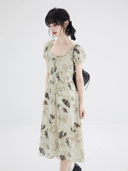 Shallot's well-tailored butterfly print textured dress, mid-length summer waist-cinching puff sleeves, sweet A-line skirt