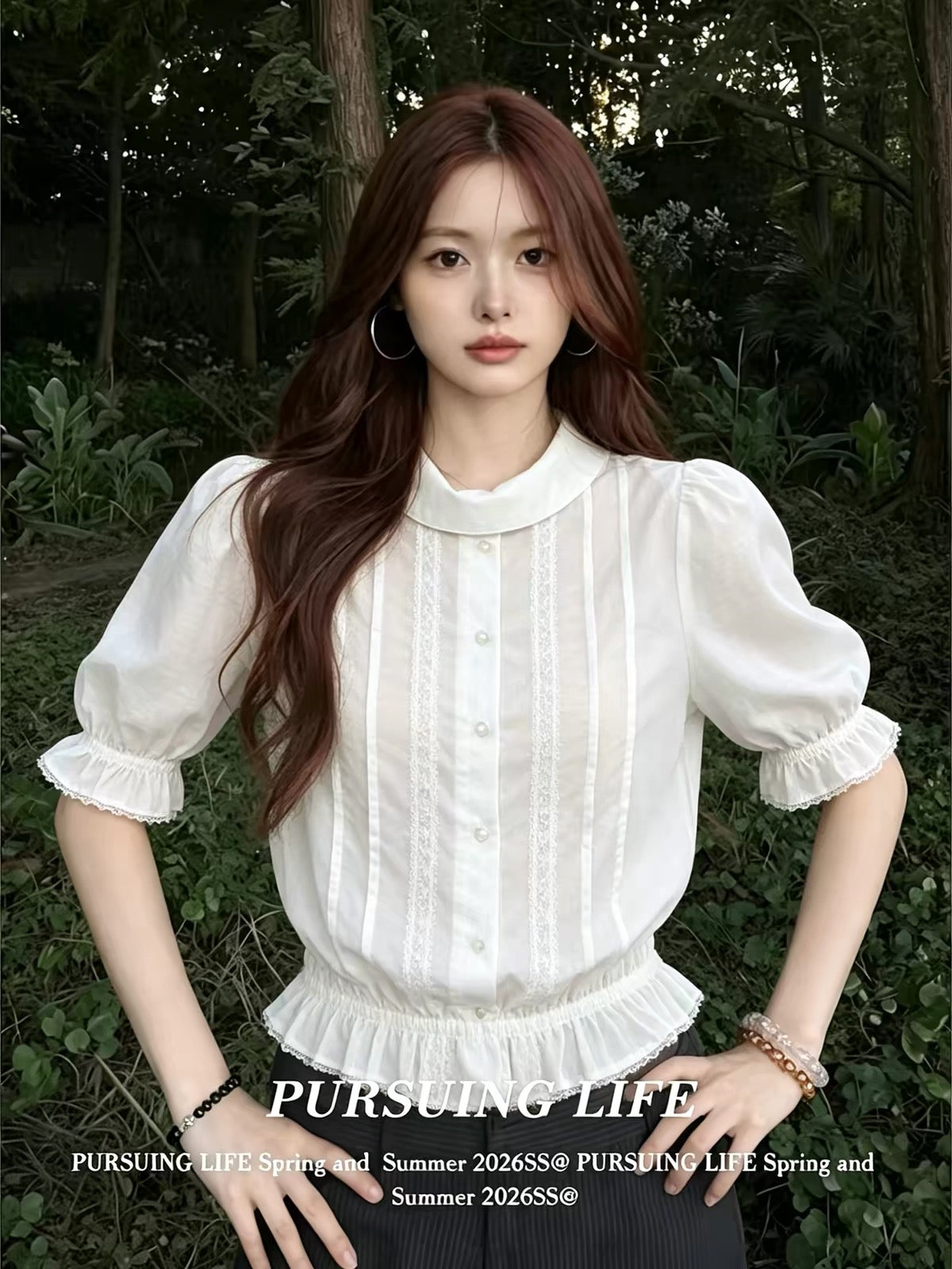 Women's French-style white collared "faux-layered" shirt; a stylish summer top featuring a fitted waist, slimming silhouette, pleated detailing, and three-quarter sleeves.