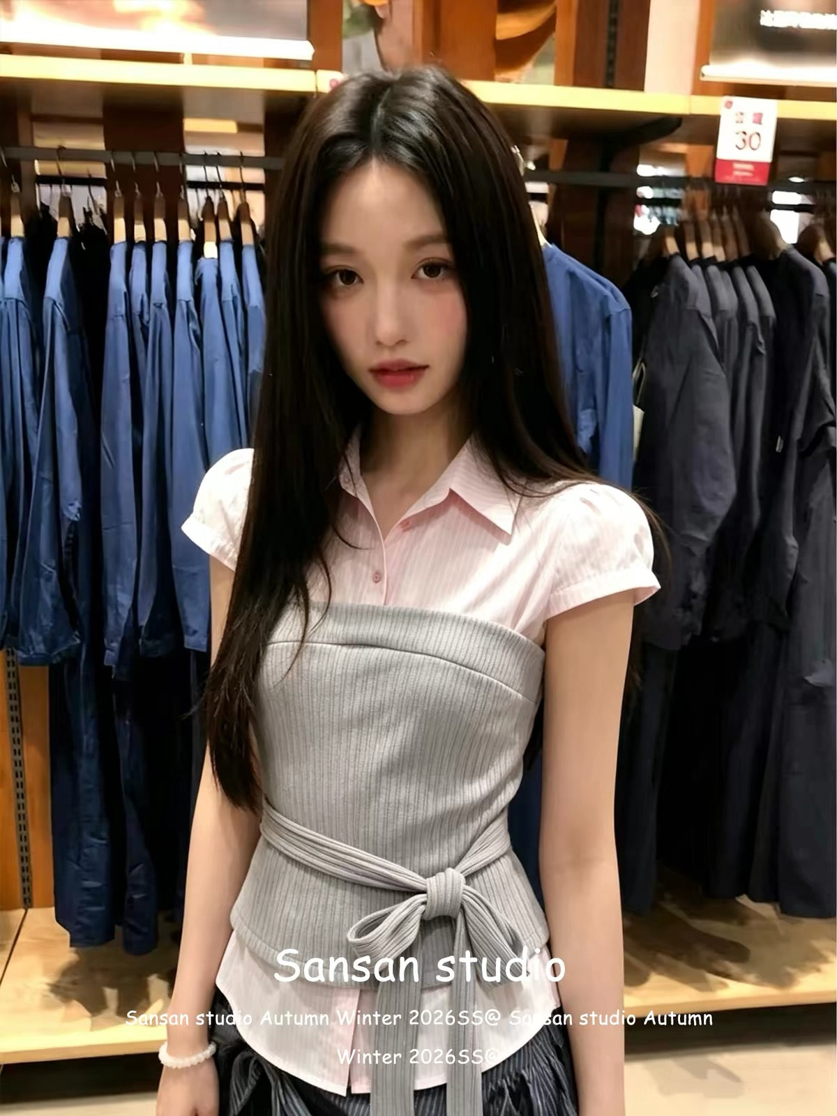 Korean-style "faux-layered" short-sleeve shirt for women—a pink, fitted, waist-cinching top featuring a structured shoulder cut and trendy lace-up detailing for a stylish, edgy look.