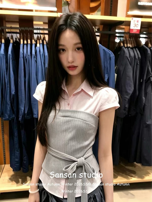 Korean-style "faux-layered" short-sleeve shirt for women—a pink, fitted, waist-cinching top featuring a structured shoulder cut and trendy lace-up detailing for a stylish, edgy look.