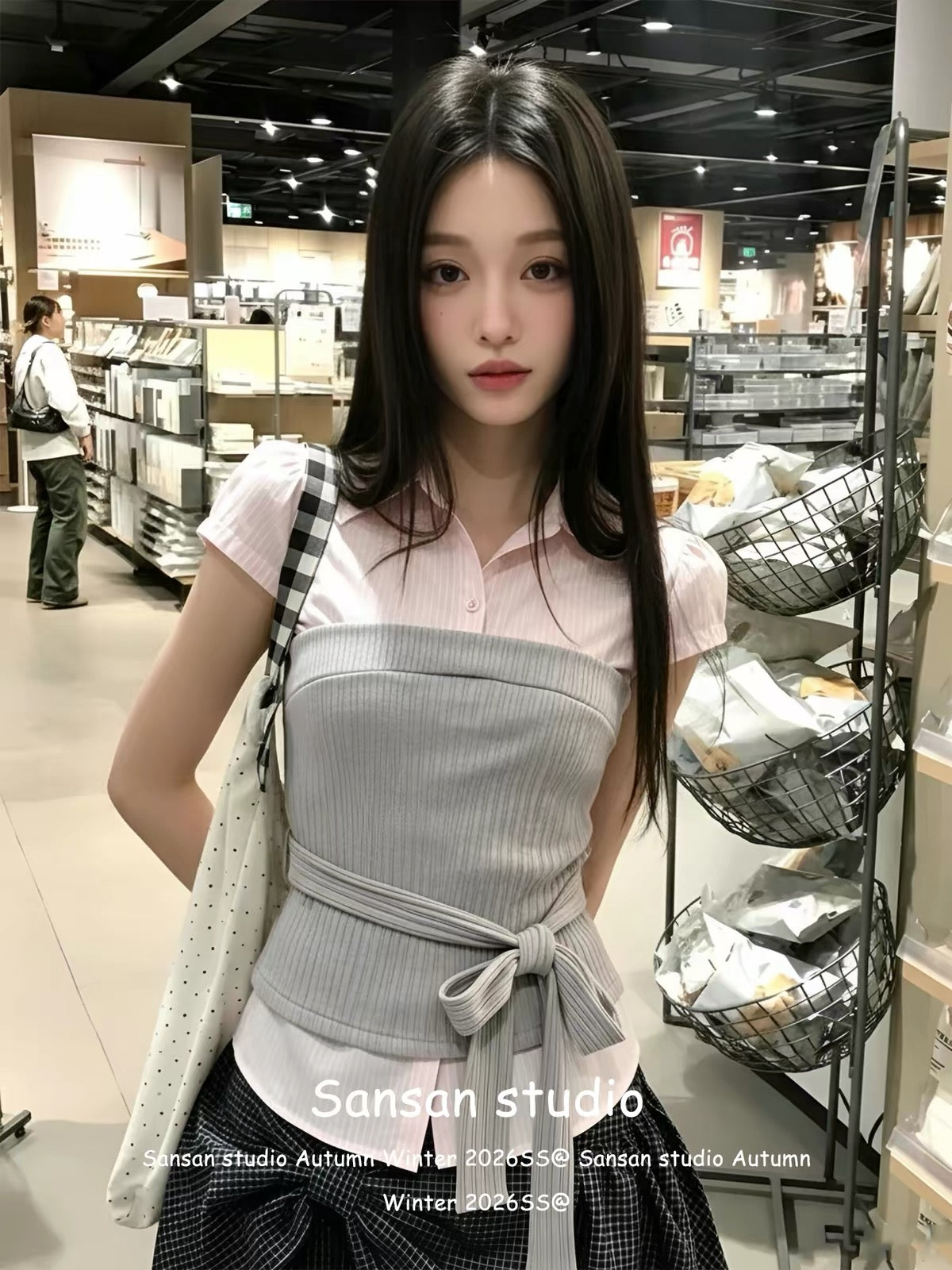 Korean-style "faux-layered" short-sleeve shirt for women—a pink, fitted, waist-cinching top featuring a structured shoulder cut and trendy lace-up detailing for a stylish, edgy look.