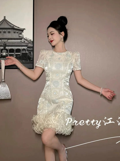 High-end, sophisticated, shimmering dress with mesh lace trim, embroidered and beaded embroidered skirt.