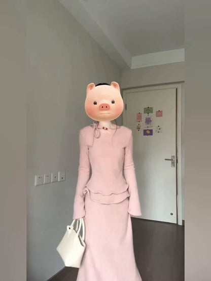 French-style gentle and feminine long-sleeved top and skirt set for autumn and winter, featuring a pink knit sweater.