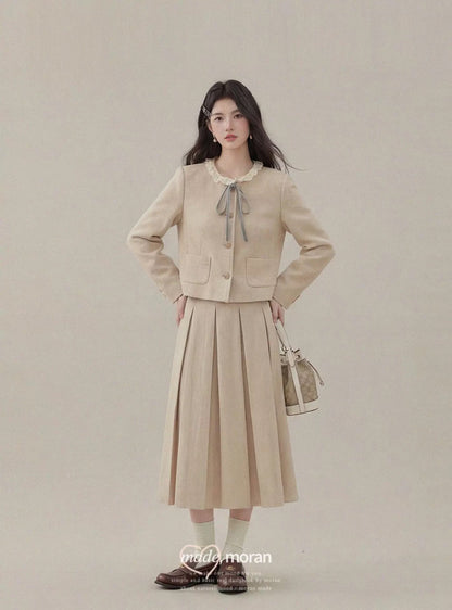 Korean-style heiress-inspired two-piece set with bow, women's autumn and winter wool short coat and pleated skirt, high-end fashion.