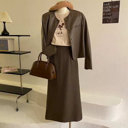 High-end brown soft PU leather jacket for women in early autumn Korean style round neck retro gold buckle temperament leather jacket black short coat