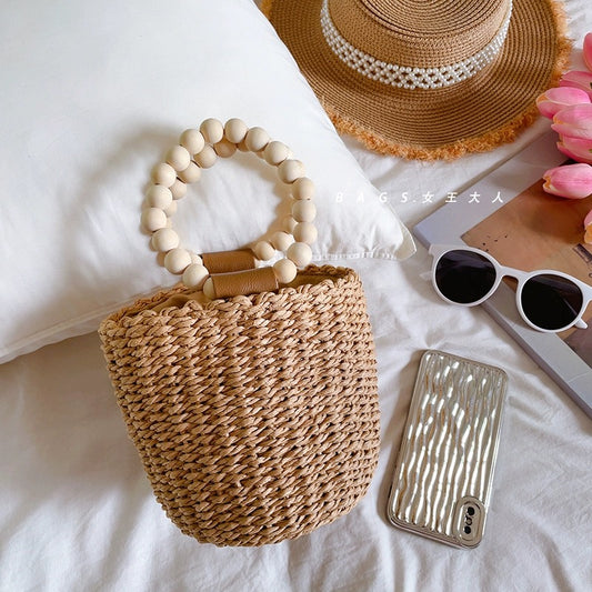 Beaded portable straw bag, hand-woven bag, round bag, small fresh and casual seaside beach handle bucket bag
