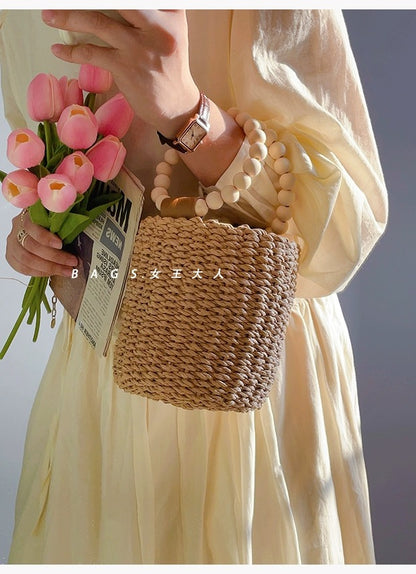 Beaded portable straw bag, hand-woven bag, round bag, small fresh and casual seaside beach handle bucket bag
