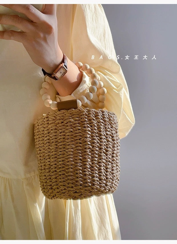 Beaded portable straw bag, hand-woven bag, round bag, small fresh and casual seaside beach handle bucket bag
