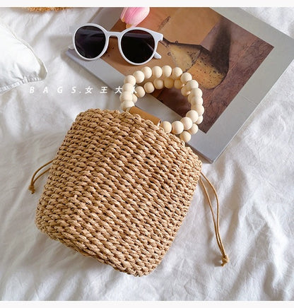 Beaded portable straw bag, hand-woven bag, round bag, small fresh and casual seaside beach handle bucket bag