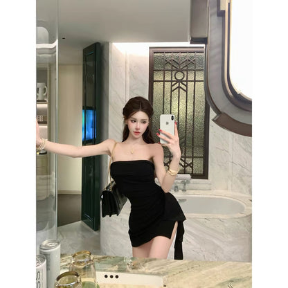 Women's off-shoulder, strapless, form-fitting dress—a stylish, sexy, and elegant piece featuring an open-back design, perfect for the early autumn season.