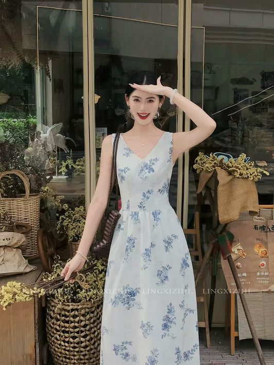 Ling Qian Zi He – French-style blue floral embroidered dress; a summer maxi dress featuring a bow-tie detail.