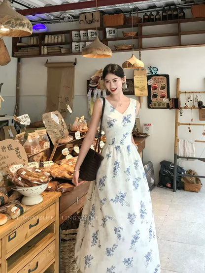 Ling Qian Zi He – French-style blue floral embroidered dress; a summer maxi dress featuring a bow-tie detail.