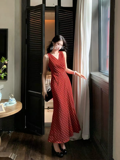 Ling Qian Zi He "Woven Dreams in Vintage Red" — French-style red polka-dot wrap dress; sleeveless, fishtail maxi cut for early autumn.