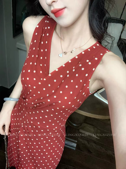 Ling Qian Zi He "Woven Dreams in Vintage Red" — French-style red polka-dot wrap dress; sleeveless, fishtail maxi cut for early autumn.