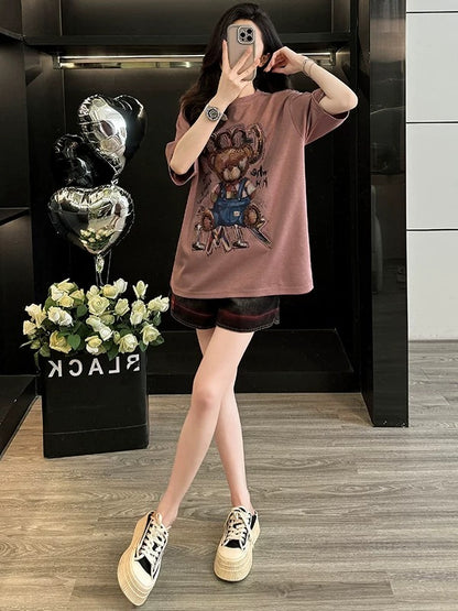 Fashionable and age-reducing leisure sports suit for women in summer, playful and cute, slimming short-sleeved T-shirt and denim shorts, two-piece suit
