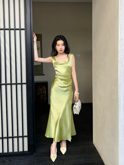 High-end celebrity whitening and slimming French resort style green acetate suspender dress 2024 new women's summer