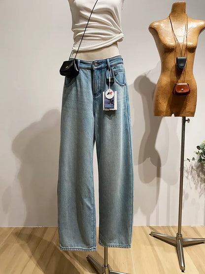Fleece-lined curved denim jeans for women, versatile high-waisted, loose-fitting, warm wide-leg pants for winter.