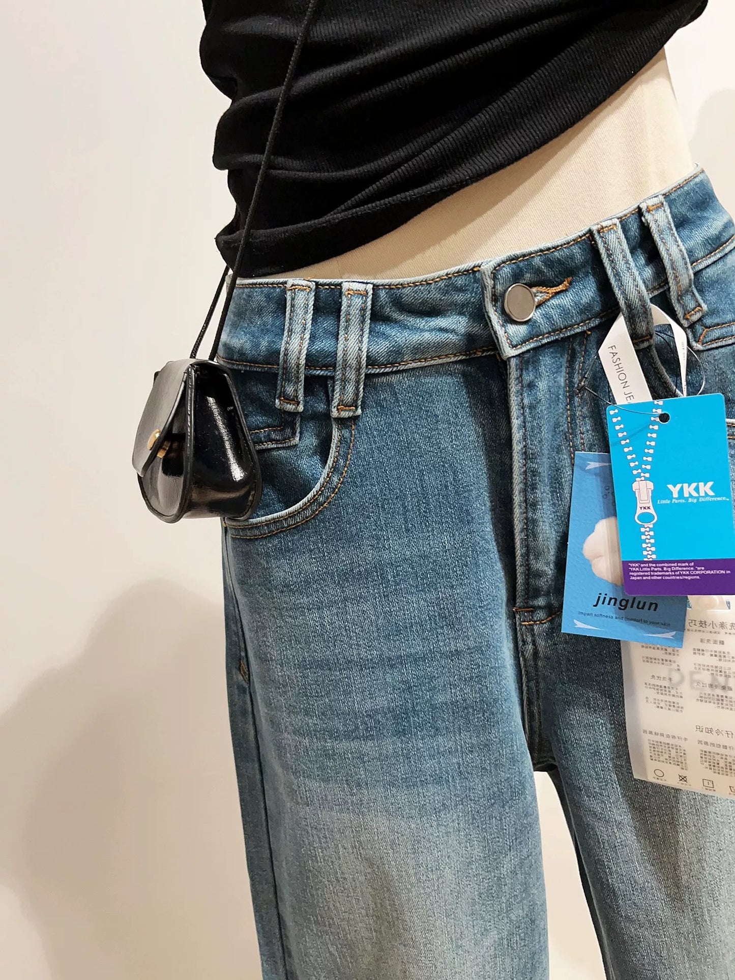 Washed distressed fleece-lined straight leg jeans for women, slimming high-waisted wide-leg trousers for winter.