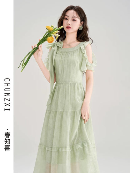 Chun Zhixi French style seaside photo taking beautiful bow dress for women summer new waist slimming temperament long dress