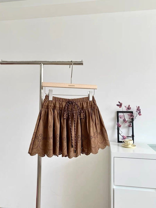 2025 summer new French pure white temperament lace embroidery hollow high waist A-line puffy short skirt female trend