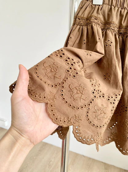 2025 summer new French pure white temperament lace embroidery hollow high waist A-line puffy short skirt female trend